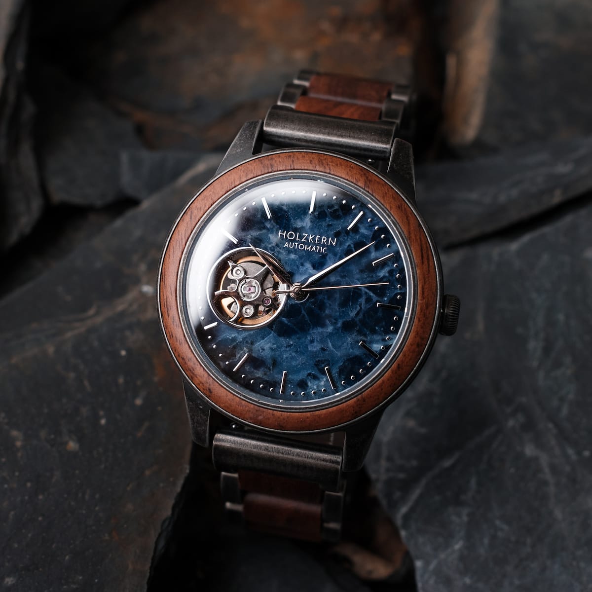 "Alrakis" watch featuring walnut and marble design with an elegant automatic movement.