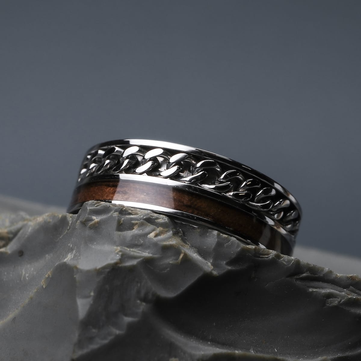 "Fractional Ring", a stylish ring crafted from walnut and silver with a sleek, modern design.