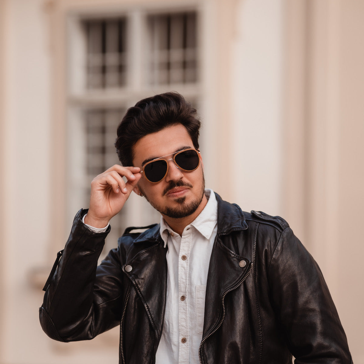 "The Honorable" sunglasses, featuring a stylish blend of teak and matte gold materials.