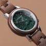 "Anakena", a stylish watch featuring walnut wood and marble accents, with a modern and elegant design.