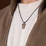"Transcendent" necklace in koa wood and antique silver, featuring a stylish and modern rectangular pendant design.