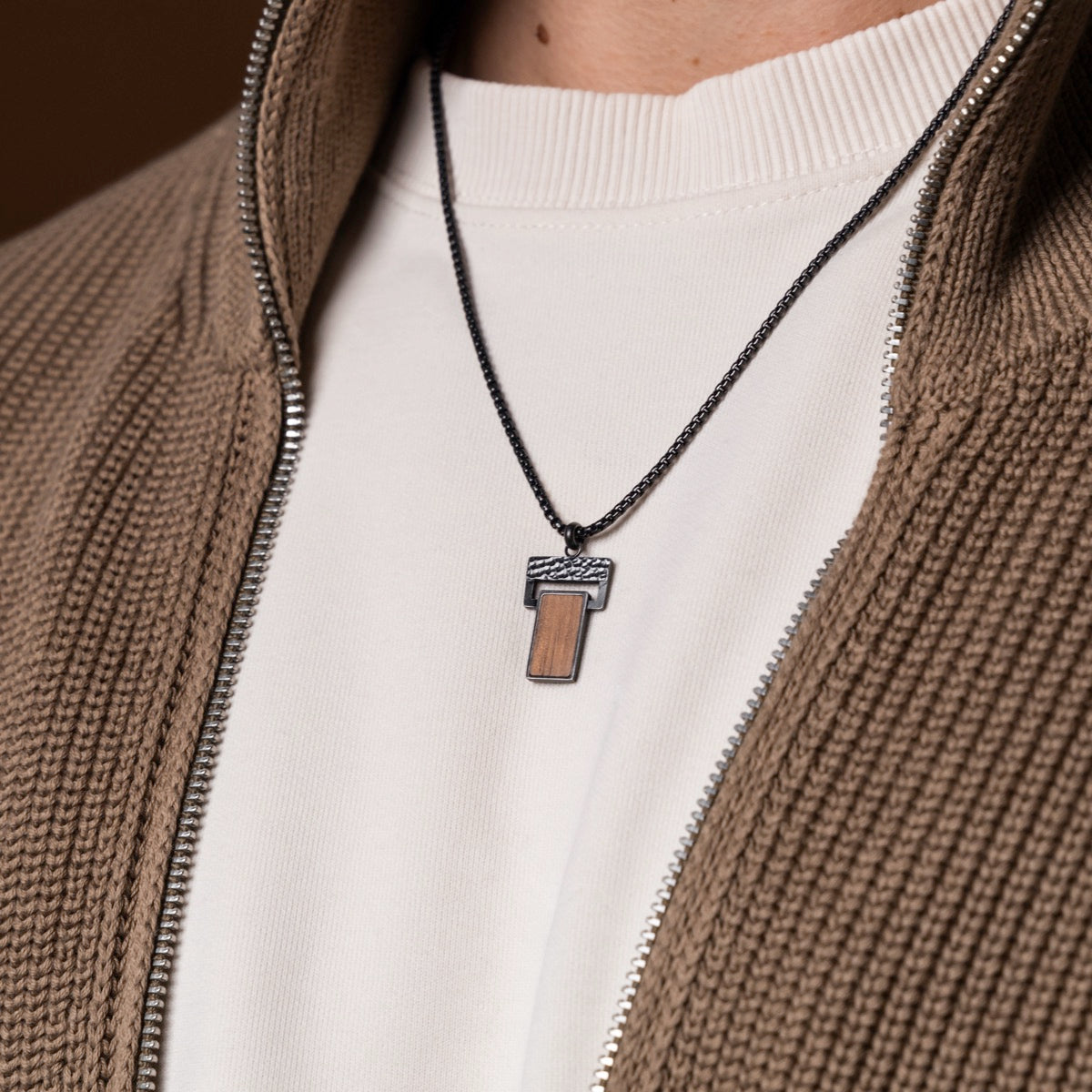 "Transcendent" necklace in koa wood and antique silver, featuring a stylish and modern rectangular pendant design.