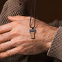 "Transcendent" necklace featuring a Koa wood and antique silver design, showcasing a sleek, modern style.