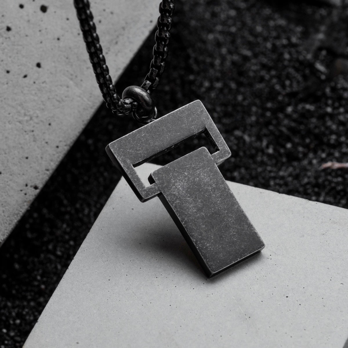 "Transcendent" artisan necklace, crafted in koa and antique silver, featuring a modern geometric design.