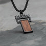 "Transcendent", a stylish pendant with koa wood and antique silver finish, featuring a modern design on a dark chain.