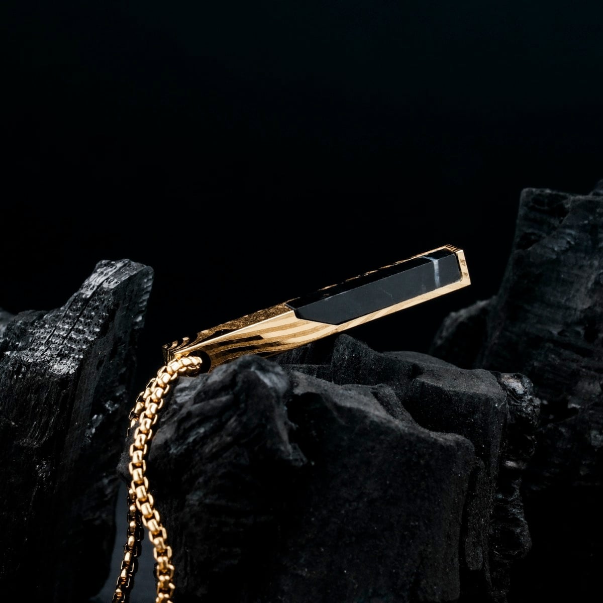 "Campania Necklace" necklace featuring black marble and Damascus accents with a sleek, modern design.