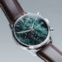 "Gifted" watch featuring a green marble face and dark brown leather strap for a sophisticated look.