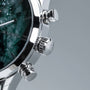 "Gifted" watch featuring a green marble face and dark brown accents with a sleek, modern design.