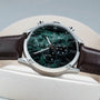 "Gifted": Elegant wristwatch featuring a green marble dial and dark brown leather strap.