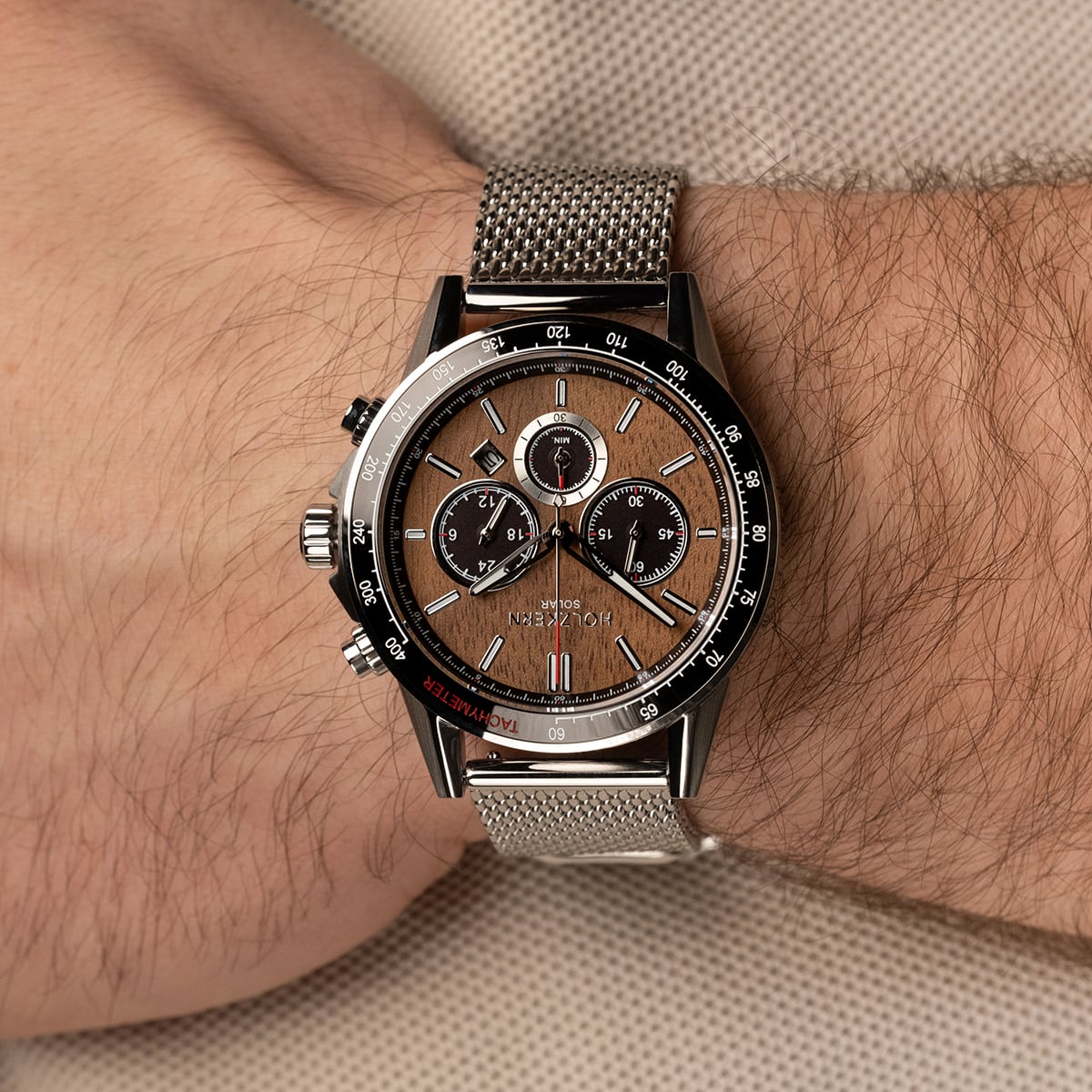 "Comfort Crusher" watch, featuring a walnut face and silver mesh strap, offering a sophisticated and modern look.