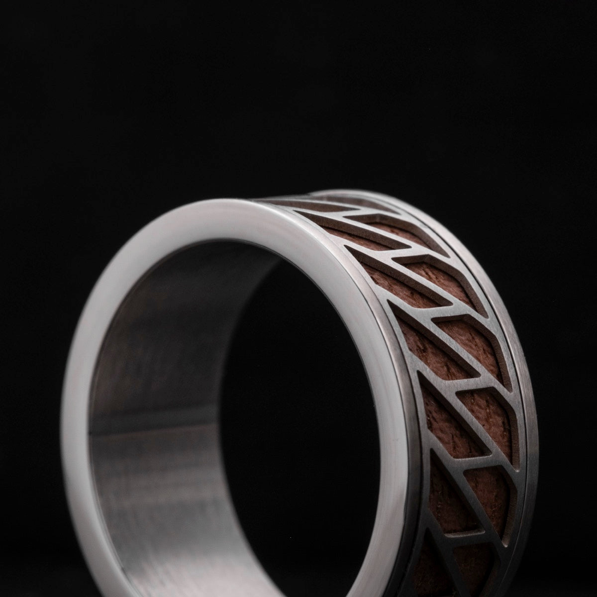 "Baritone Rings" ring blends elegant walnut wood with sleek silver accents.