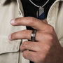 "Fractional Ring" - walnut and silver ring with a sleek, modern design.