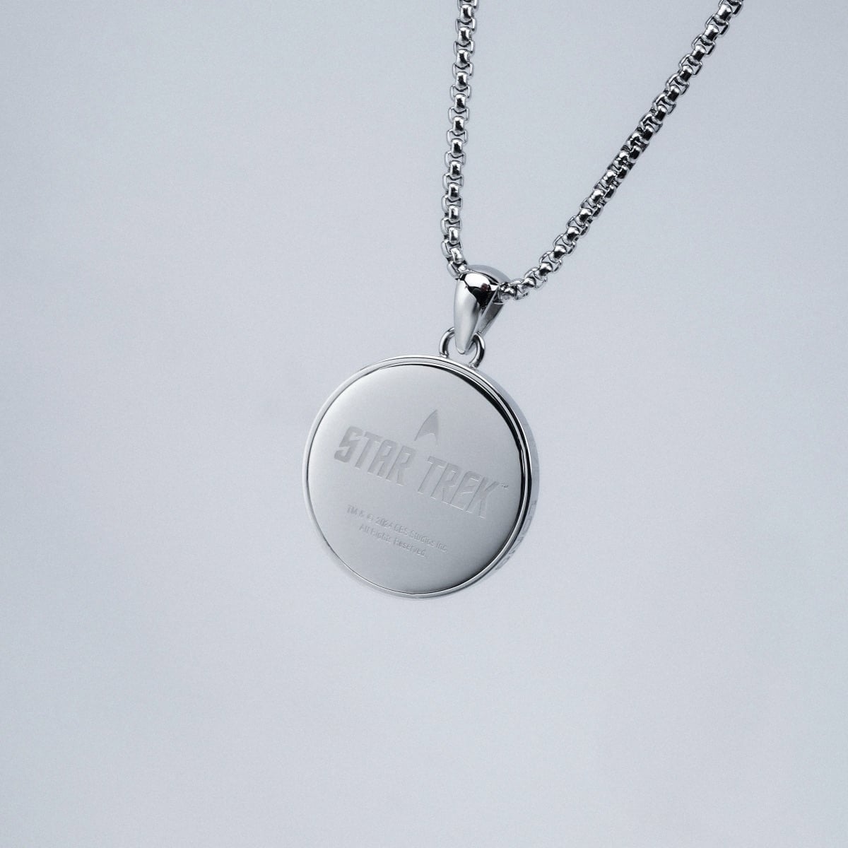 "Sciences Necklace", a silver-toned necklace with a sleek, modern design.
