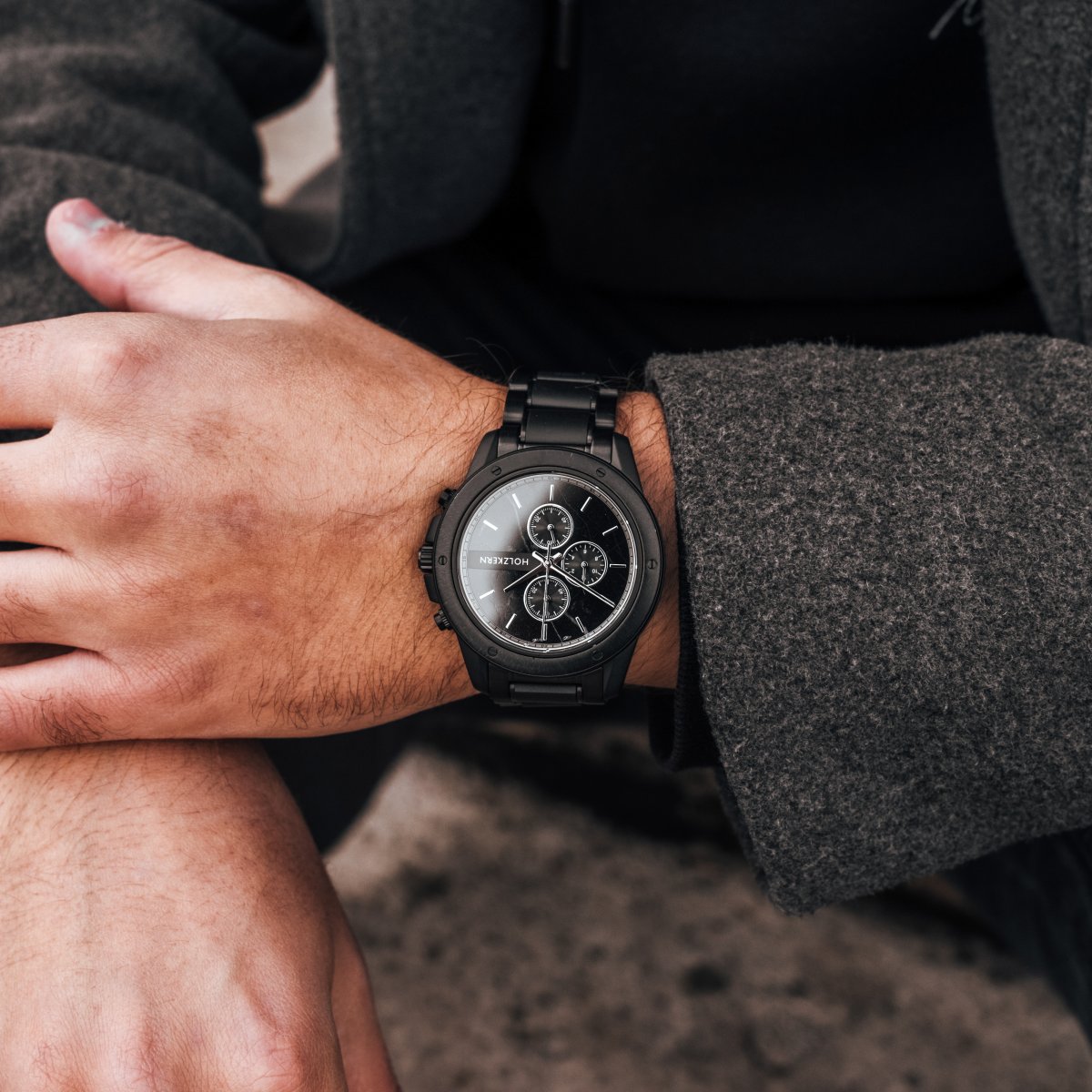 "Lucan" watch featuring a sleek, modern design with a dark maple and marble finish on the wrist.