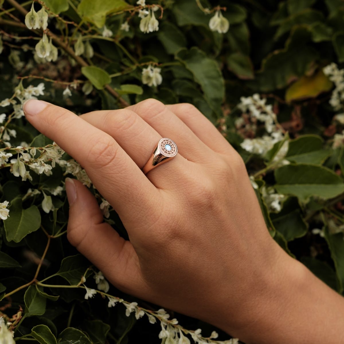 "Pixa Ring" ring in nacre and rose gold on hand, displaying an elegant and natural design.