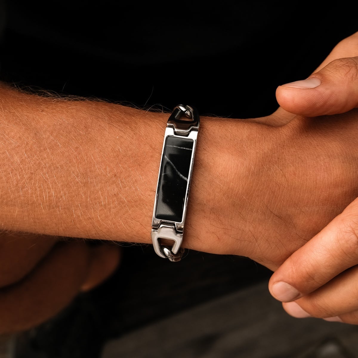 "Modulus Bracelet" bracelet features a sleek, modern design with marble and silver elements.