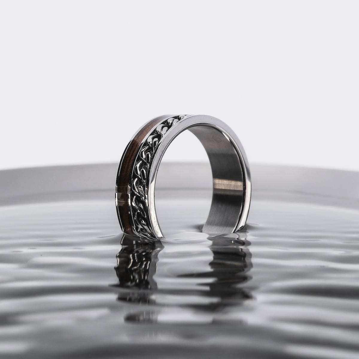 "Fractional Ring" - Elegant ring featuring walnut and silver accents with a sleek, modern design.