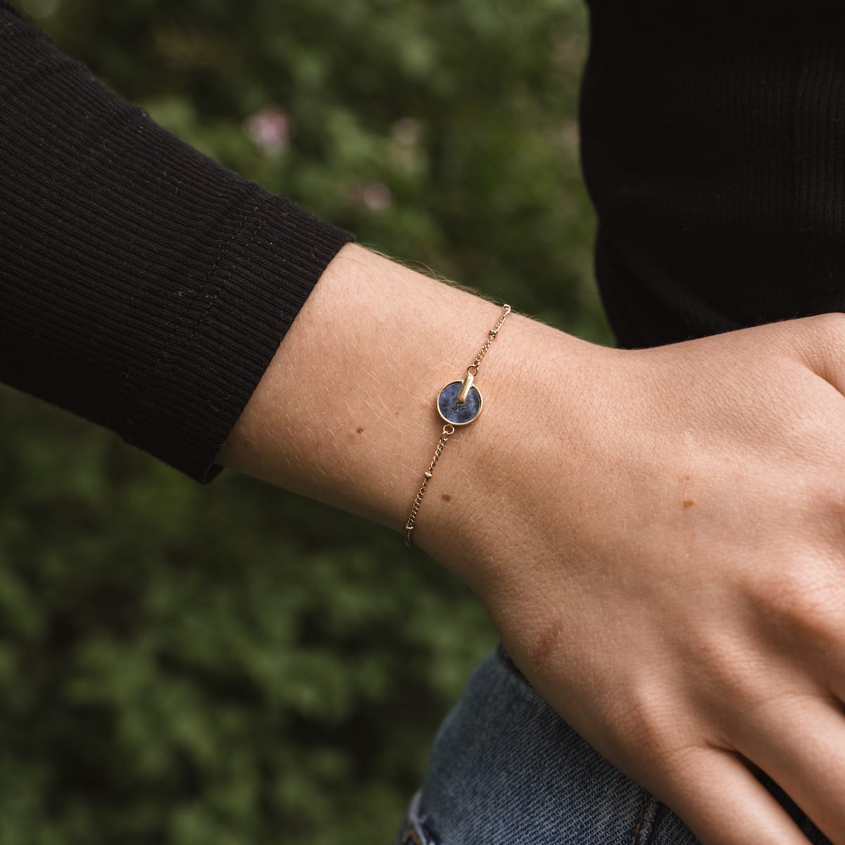 "Opacity Bracelet" bracelet featuring a blue marble stone and rose gold accents, showcasing an elegant and modern style.