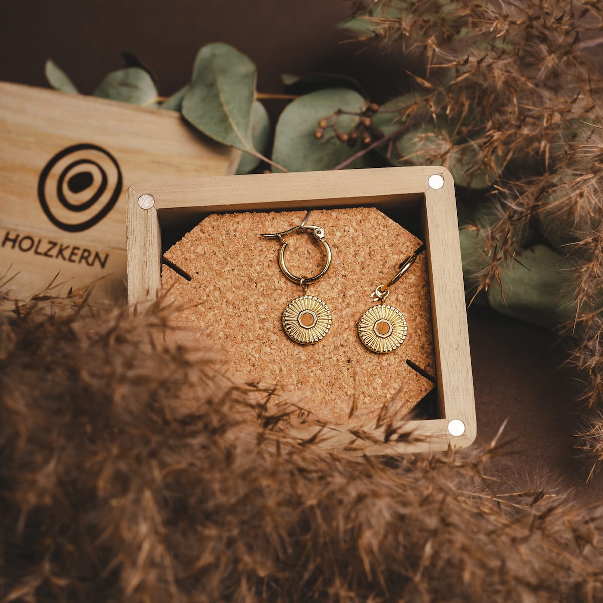 "Stencil Earrings" earrings, combining koa wood and gold, with a stylish and intricate design.