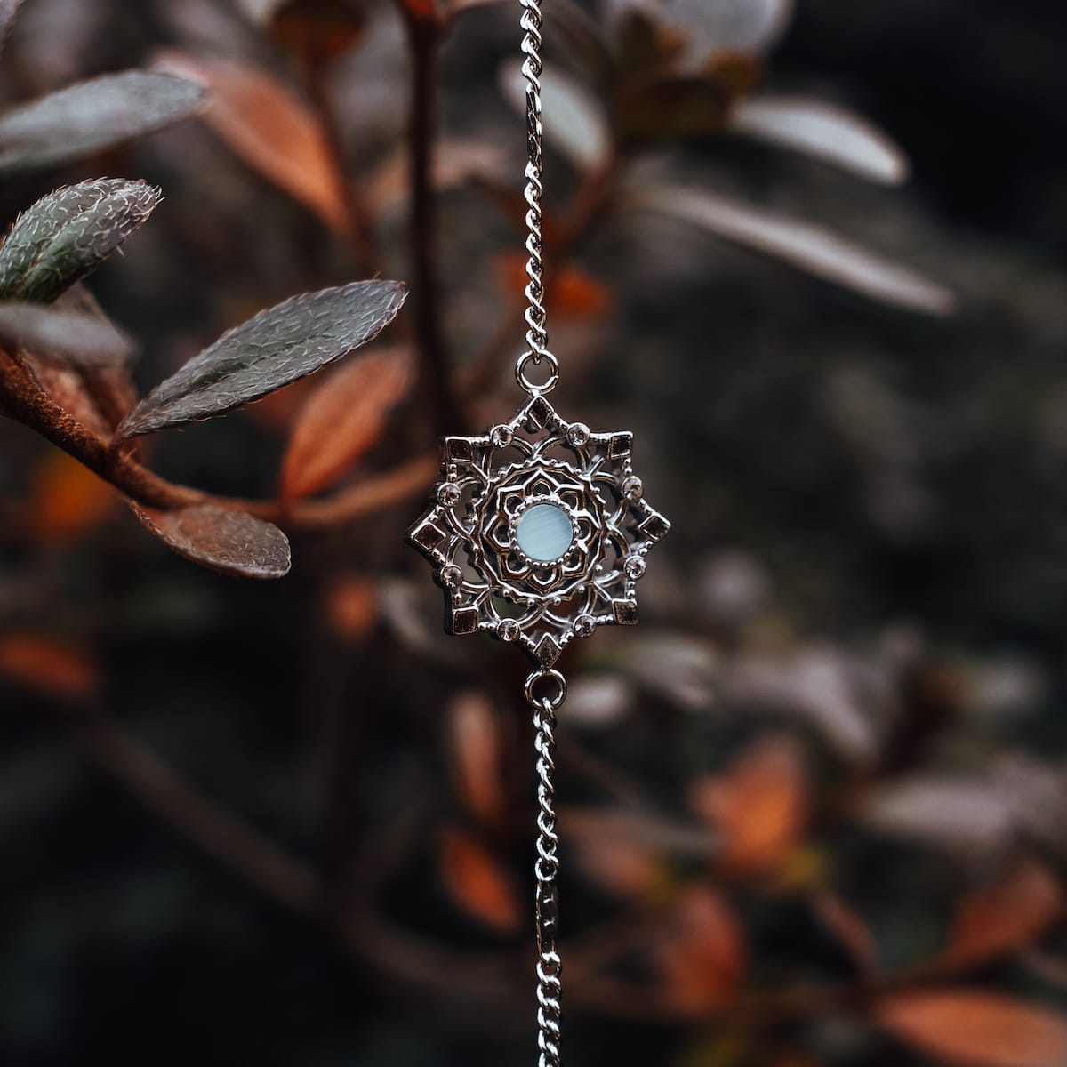 "Aphonia Bracelet" bracelet featuring aquamarine and silver in an intricate, nature-inspired design.