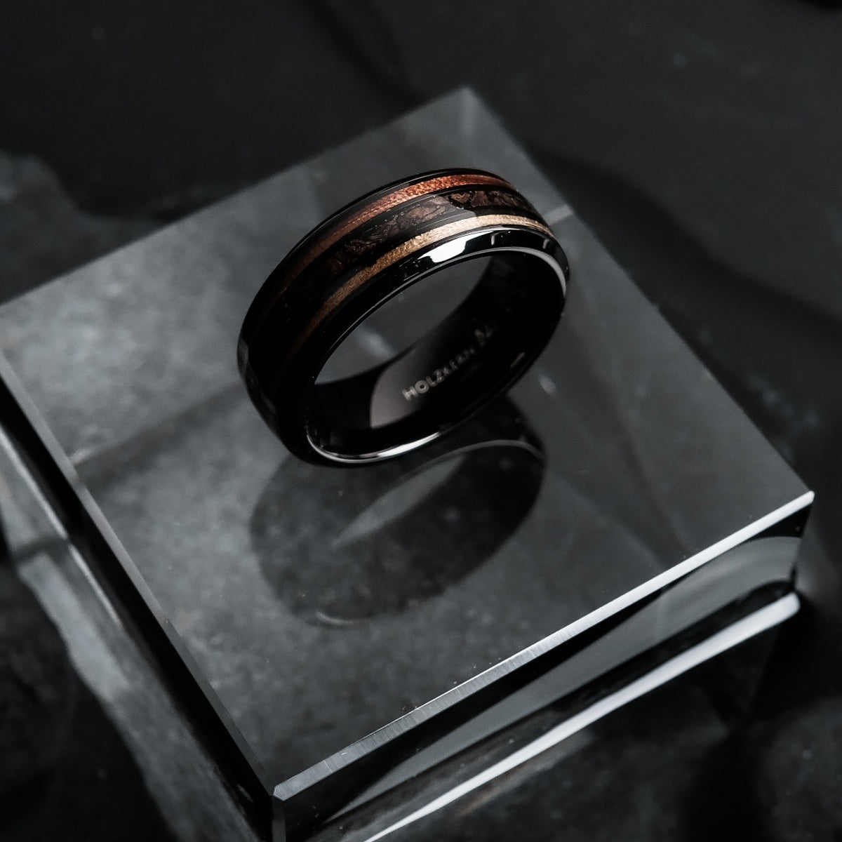 "Cartesian Ring": Sleek ring crafted from Zebrawood and black material with a modern, elegant design.