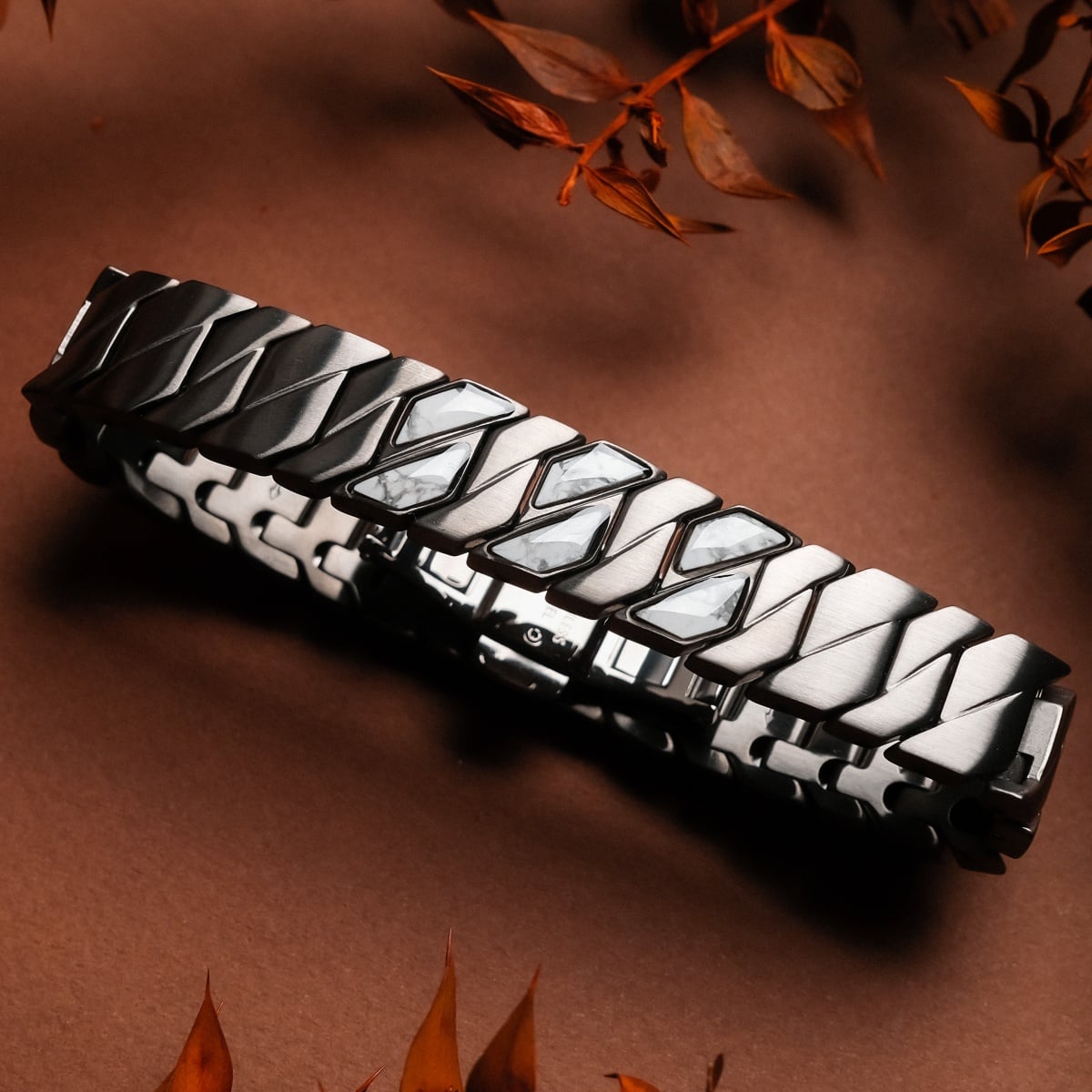 "Baritone" bracelet features an elegant design with howlite accents and a dark grey finish.