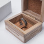 "Fractional Ring" ring featuring a walnut and silver design in an elegant wooden box.