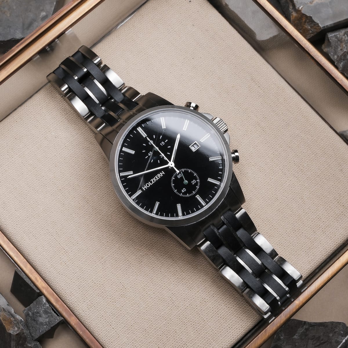 "The Observant, a sleek wristwatch featuring a black dial with a maple and marble band."