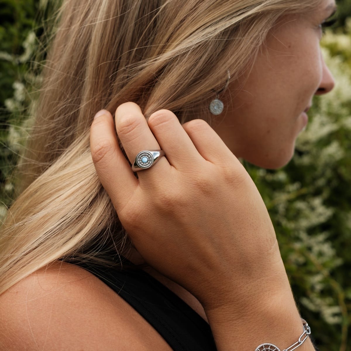 "Pixa Ring" ring featuring nacre and silver, showcasing intricate design on a hand for elegant style.