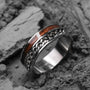 "Fractional Ring" ring featuring walnut and silver with a sleek, textured design.
