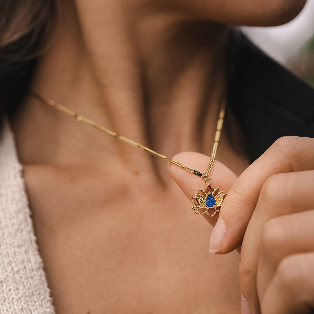 "Balance Necklace", a gold lapis lazuli necklace, featuring an elegant and balanced design.