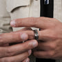 "Fractional Ring": A stylish ring crafted from walnut and silver with a modern aesthetic.