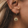 "Stencil Earrings": Elegant earrings featuring a gold and marble design with a modern, intricate pattern.