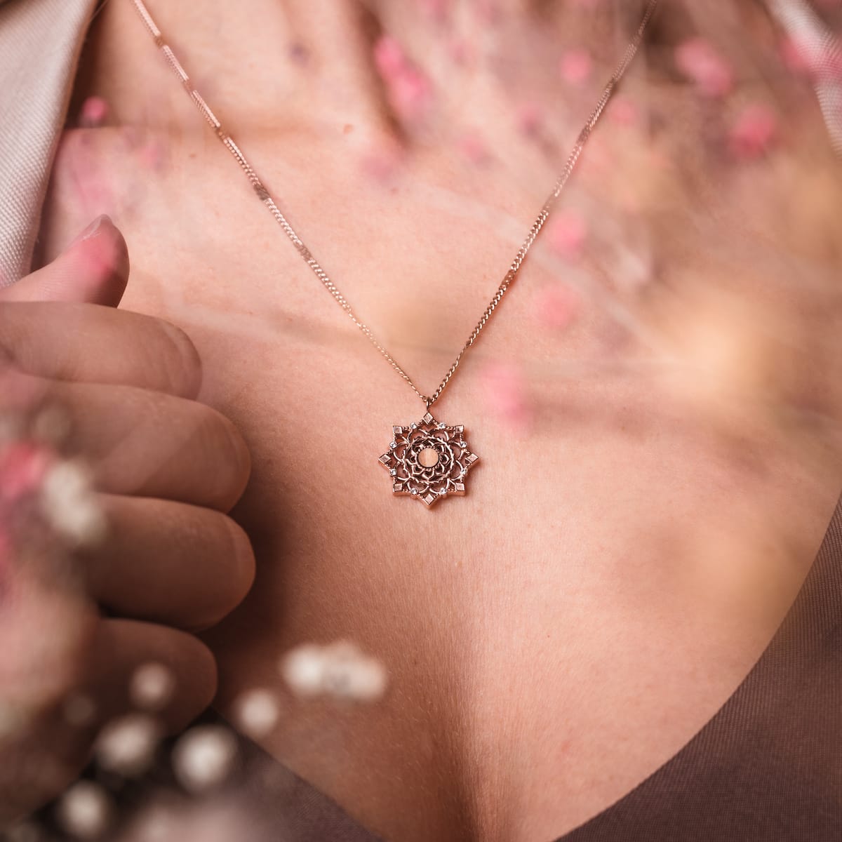 "Aphonia Necklace" necklace featuring a rose gold design with olive accents, capturing an elegant and intricate visual style.
