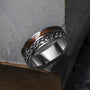 "Fractional Ring", a stylish ring featuring walnut wood and silver accents with a contemporary design.