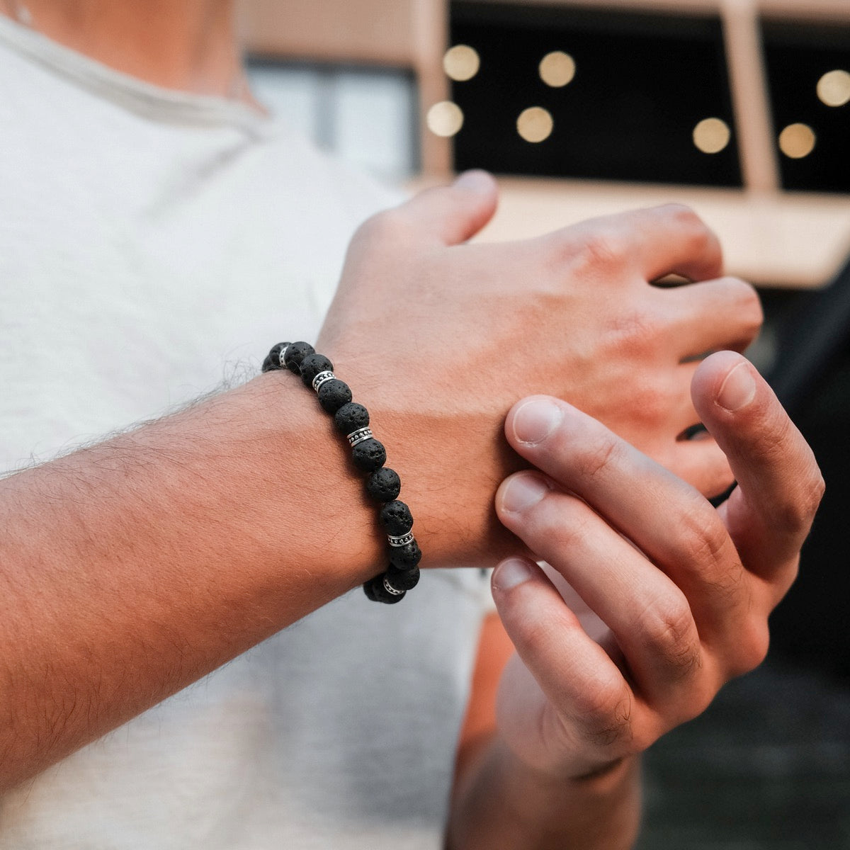 "Superset" bracelet featuring a sleek design with textured black lava beads.