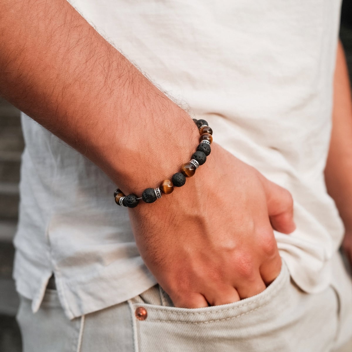 "Superset" bracelet featuring a blend of earthy tiger eye and lava stone beads, offering a natural and rugged style.