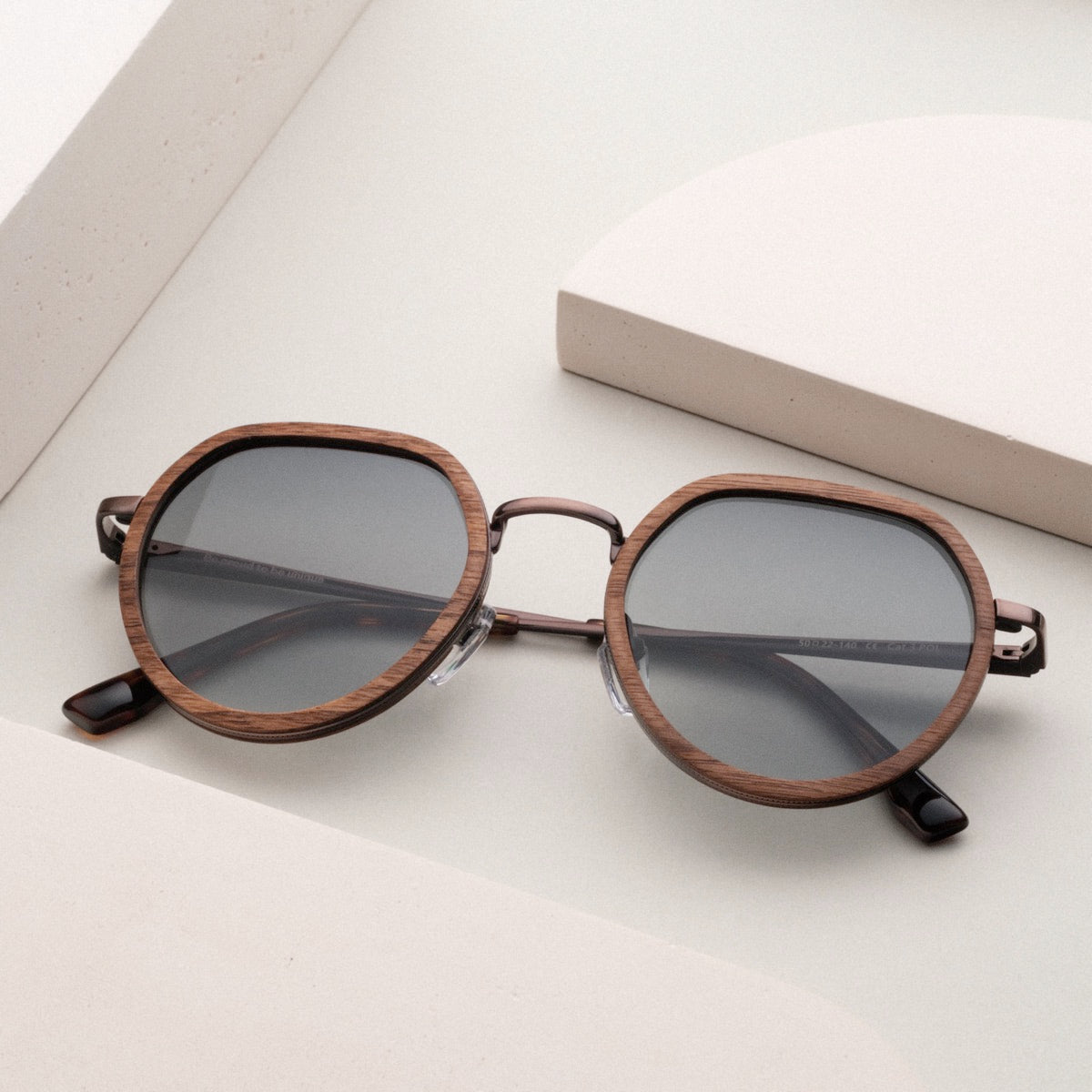"The Wanderer" sunglasses featuring a stylish walnut and bronze design.