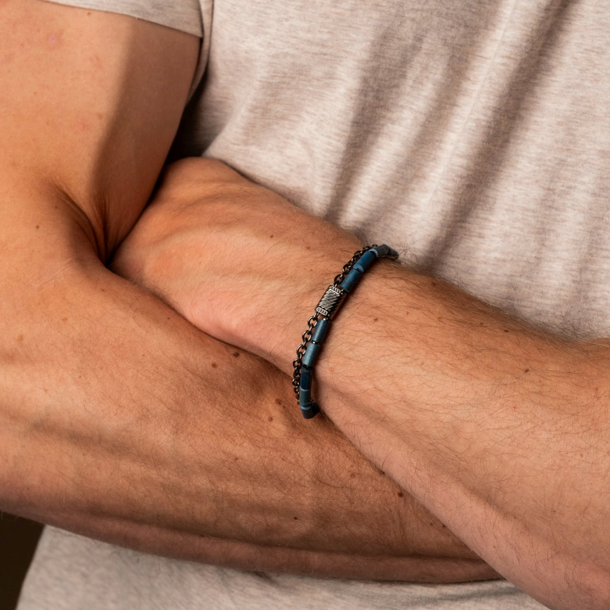 "Supersonic" bracelet featuring a sleek maple and gray design, worn on a wrist for a stylish look.