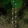 "Summersweet Earrings II": elegant pearl and rose gold earrings with a delicate chain design.