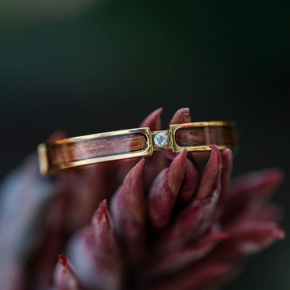 "Campania Ring": Elegant ring featuring Sapele wood and gold accents with a diamond centerpiece.