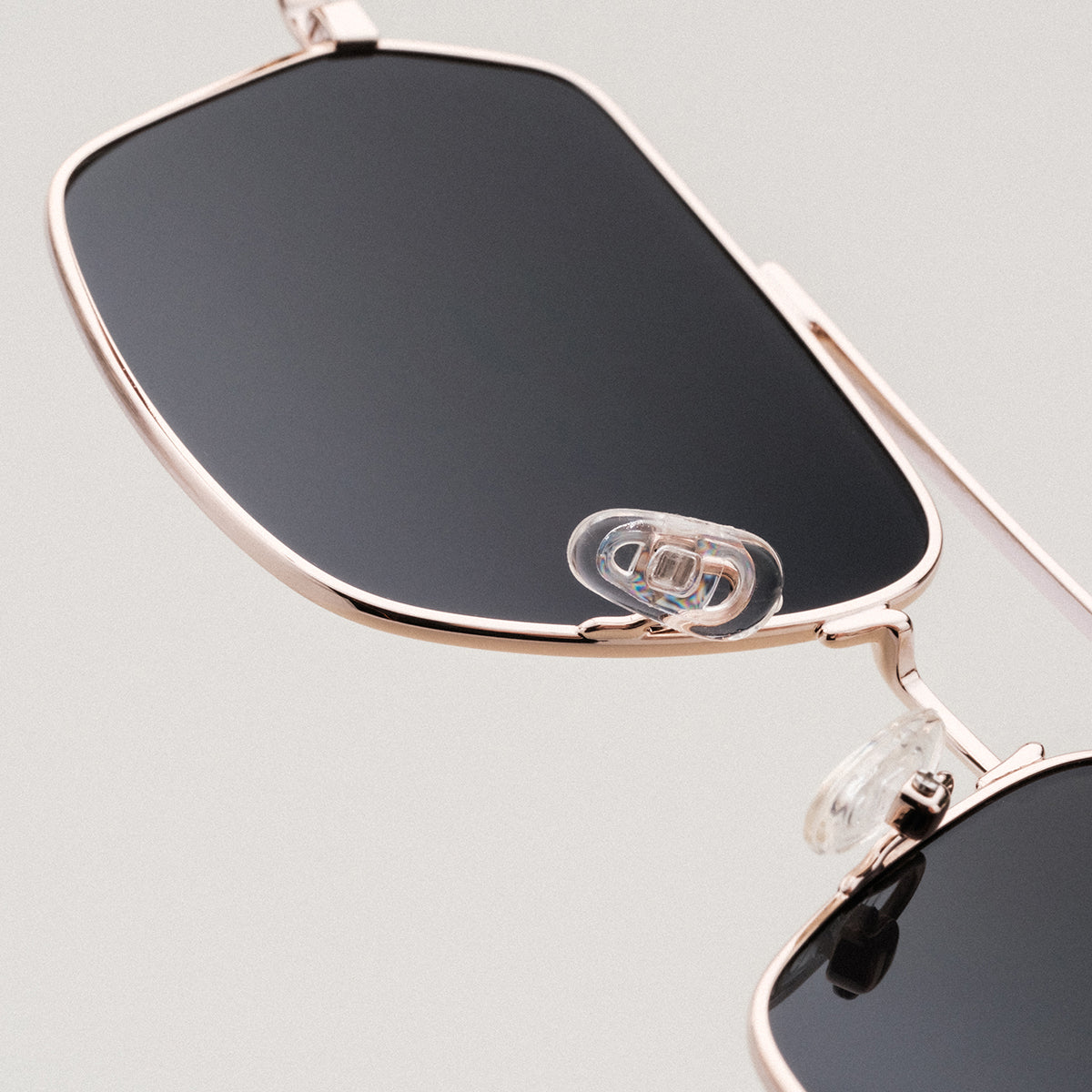 "The Professor I" sunglasses featuring a padauk frame and matte gold accents, showcasing a sleek and modern design.