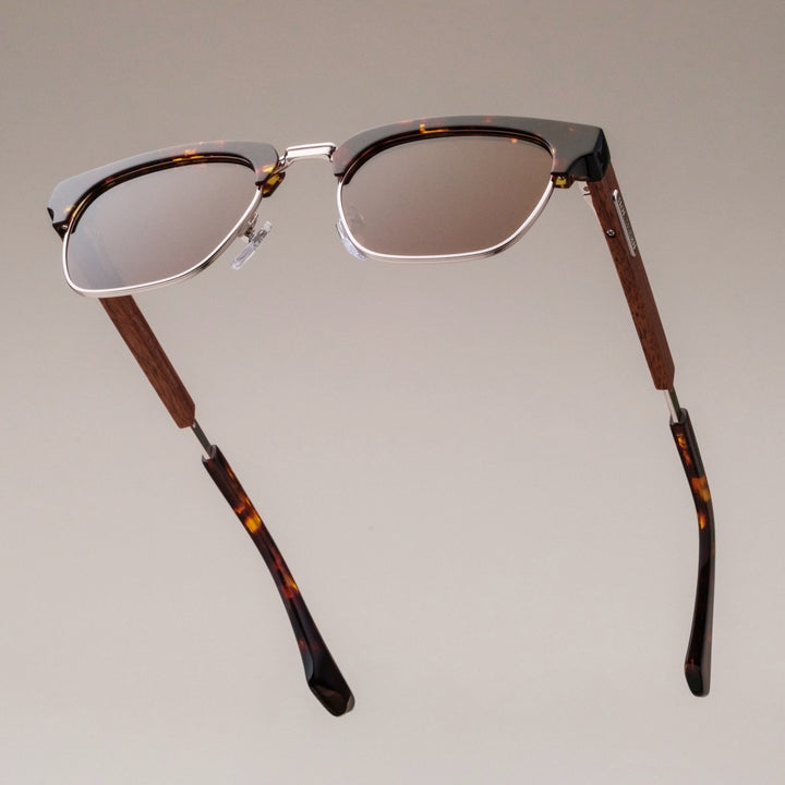 "The Virtuoso" sunglasses featuring a walnut and havana design with sleek style.