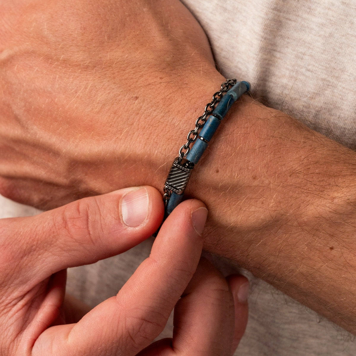 "Supersonic", a stylish bracelet with a maple and gray design, worn on the wrist.