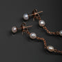 "Summersweet Earrings II": Pearl and rose gold earrings with a delicate, elegant design.