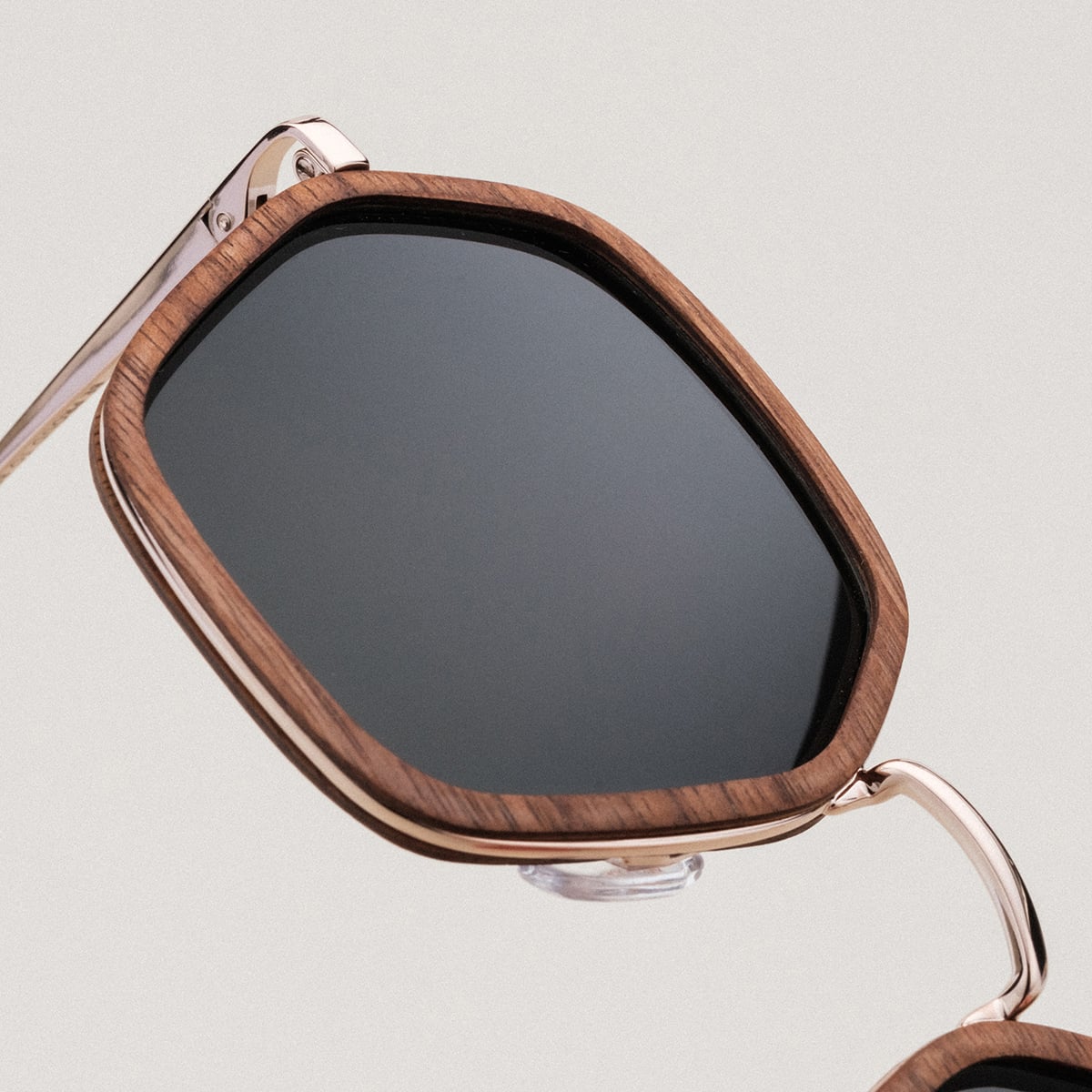 "The Sincere" sunglasses with walnut finish and matte gold accents.