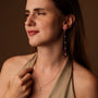 "Summersweet Earrings II": Elegant rose gold earrings adorned with pearls, showcasing a refined and sophisticated style.