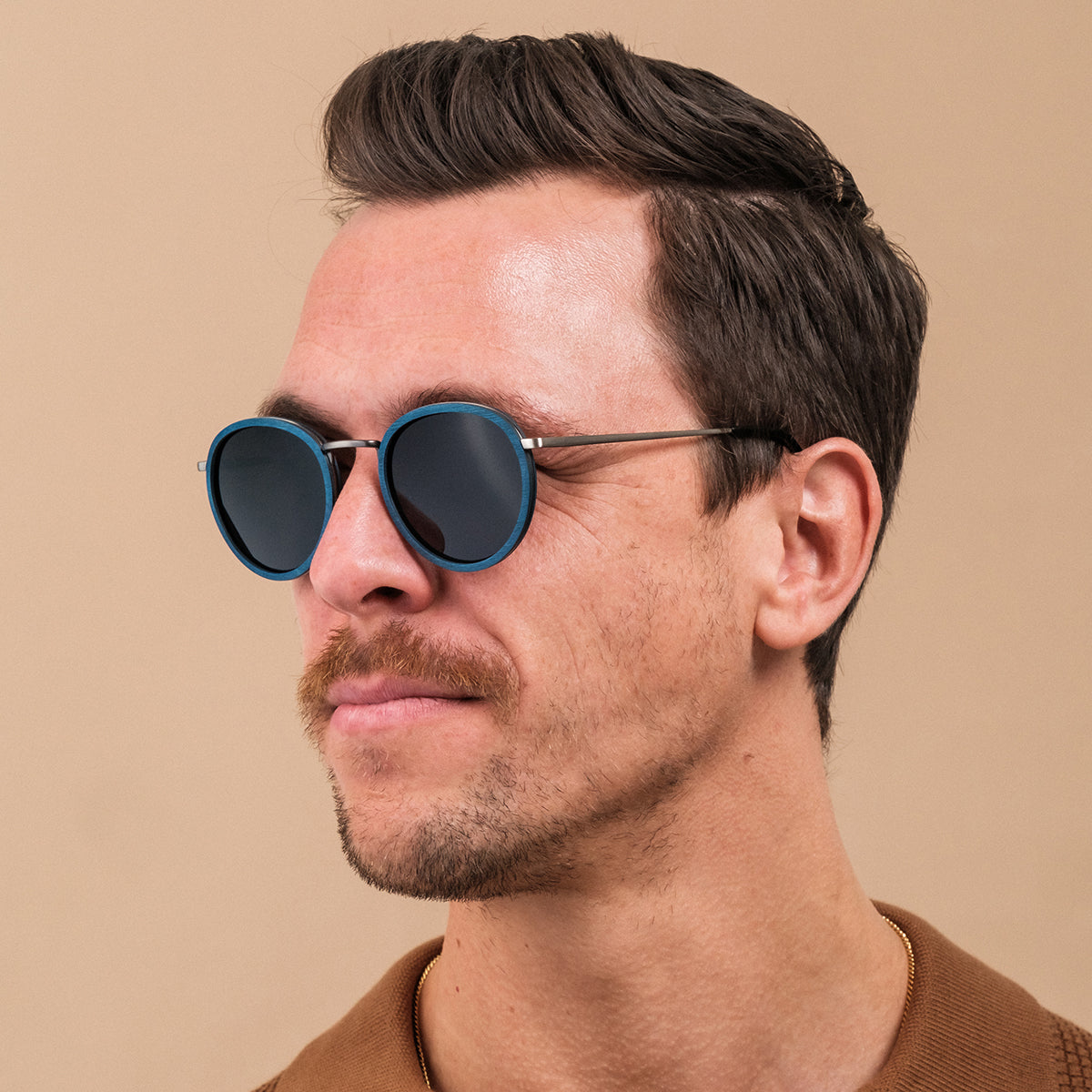 "The Loving", stylish sunglasses featuring a round design with maple and dark grey accents.