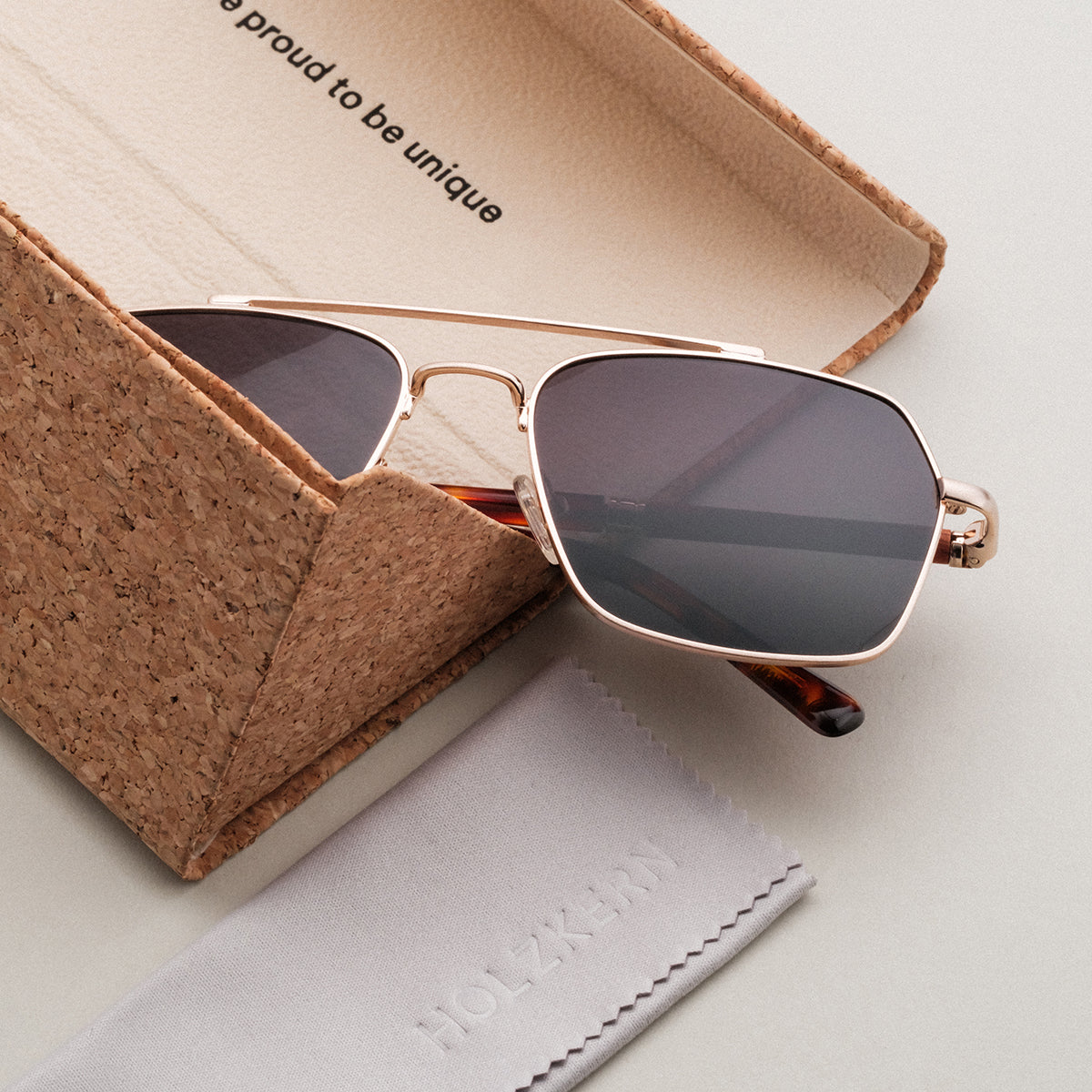 "The Professor I" sunglasses featuring a sleek design with Padauk wood accents and matte gold frame.