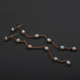 "Summersweet Earrings II" earrings in pearl and rose gold, featuring an elegant and delicate chain design.